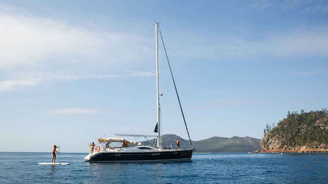 milady-french-yacht-australia-cruise-stand-up-paddle-board-near-boat